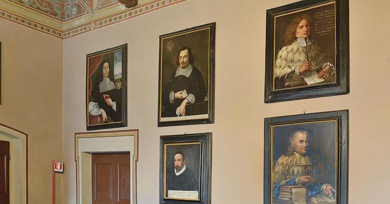 A series of paintings exhibited in the collection, depicting notable figures from Panicale, including warriors, jurists, writers, and religious personalities of diverse origins.