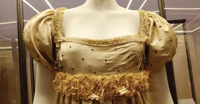 Alexandrine Bonaparte’s dress, white with black polka dots, featuring a wide neckline and a train