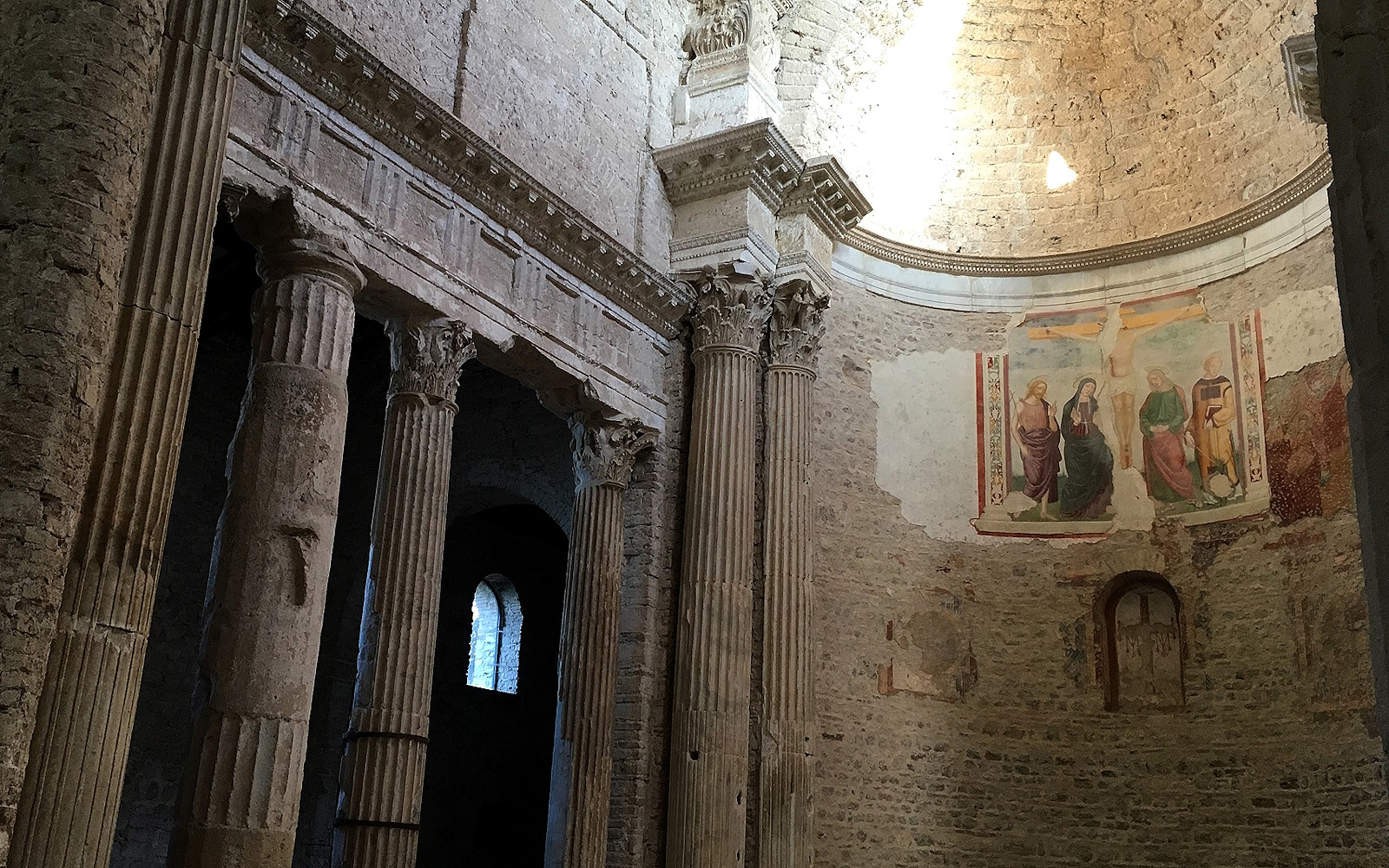 Interior of the Basilica of San Salvatore with apse and spolia columns