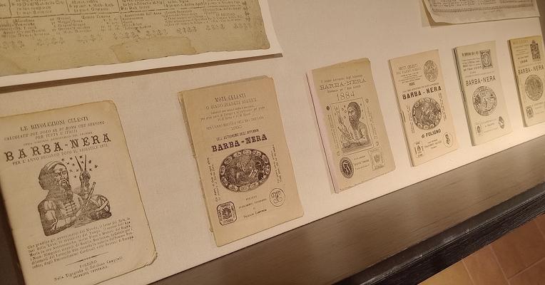 Set of five booklet almanacs with black and white illustrations depicting Barbanera