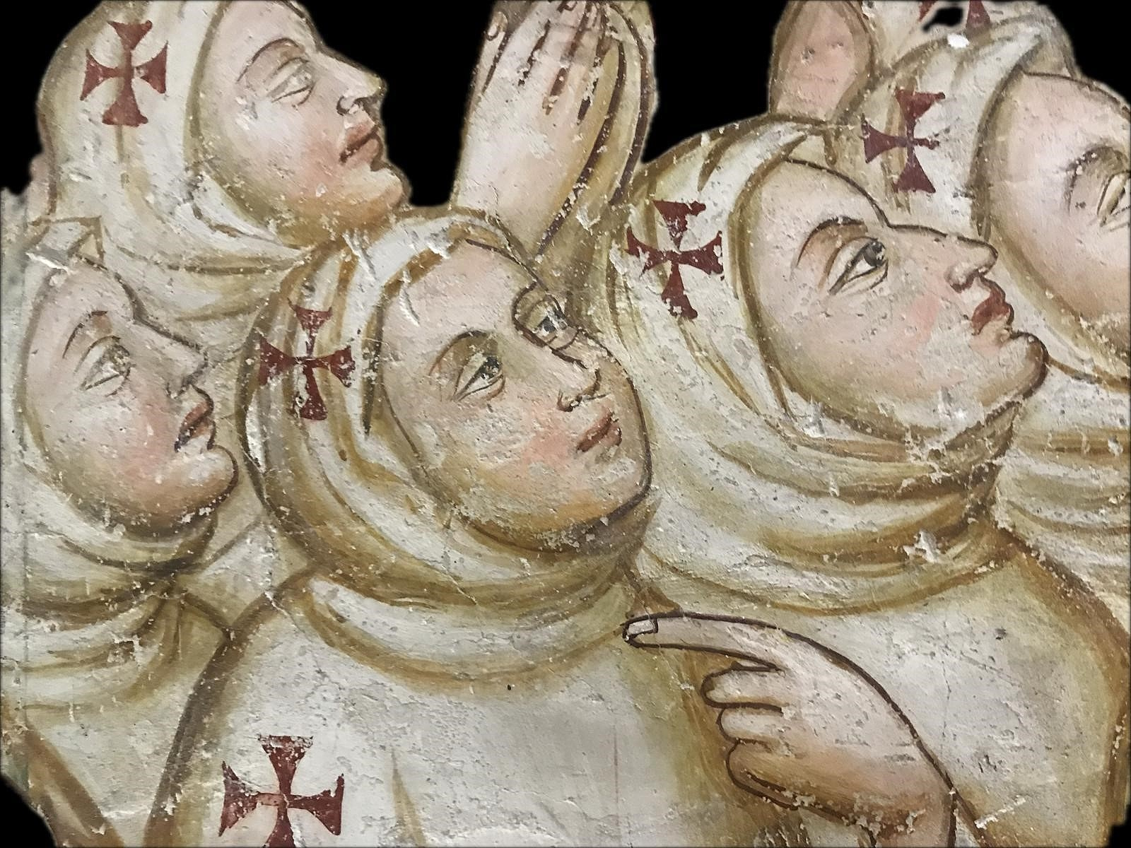 Detail of the Procession of the Whites fresco: figures with white hoods and red crosses, gazing towards the sky.