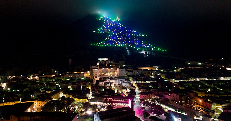 Night view of Gubbio with the illuminated Christmas Tree on Mount Ingino overlooking the city.